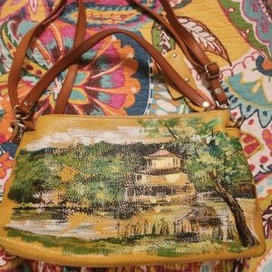 Yellow leather bag with paint